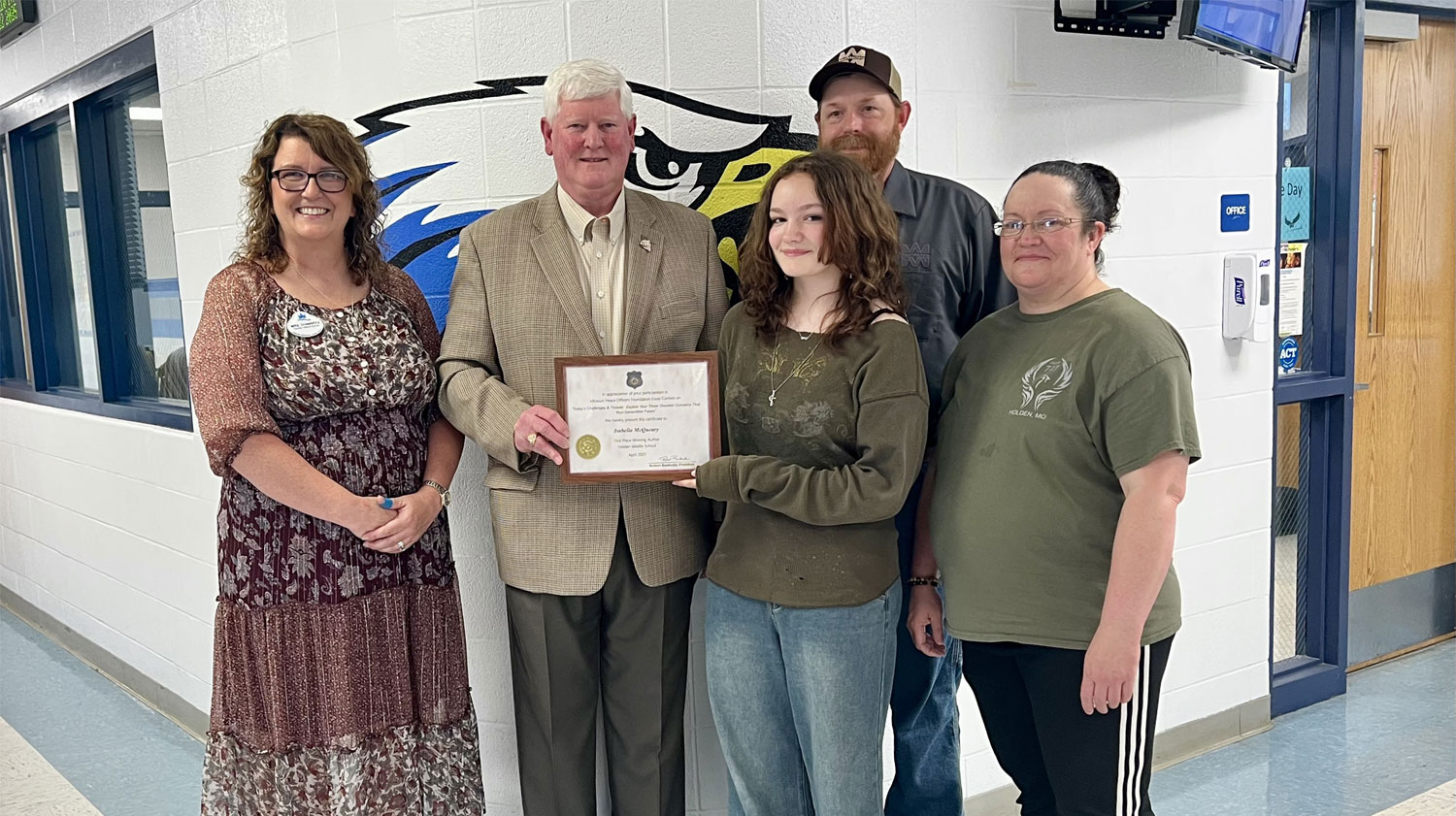 Essay Contest Winner – West Side – 1st Place – Isabella McQueary Holden Middle School Pictured L to R: Mrs. Tobi Chambers (Isabella’s teacher), MPOA member Retired Deputy Sheriff Tom Krahenbuhl (Jackson CO SO), Isabella, and Mr. & Mrs. McQueary (parents)