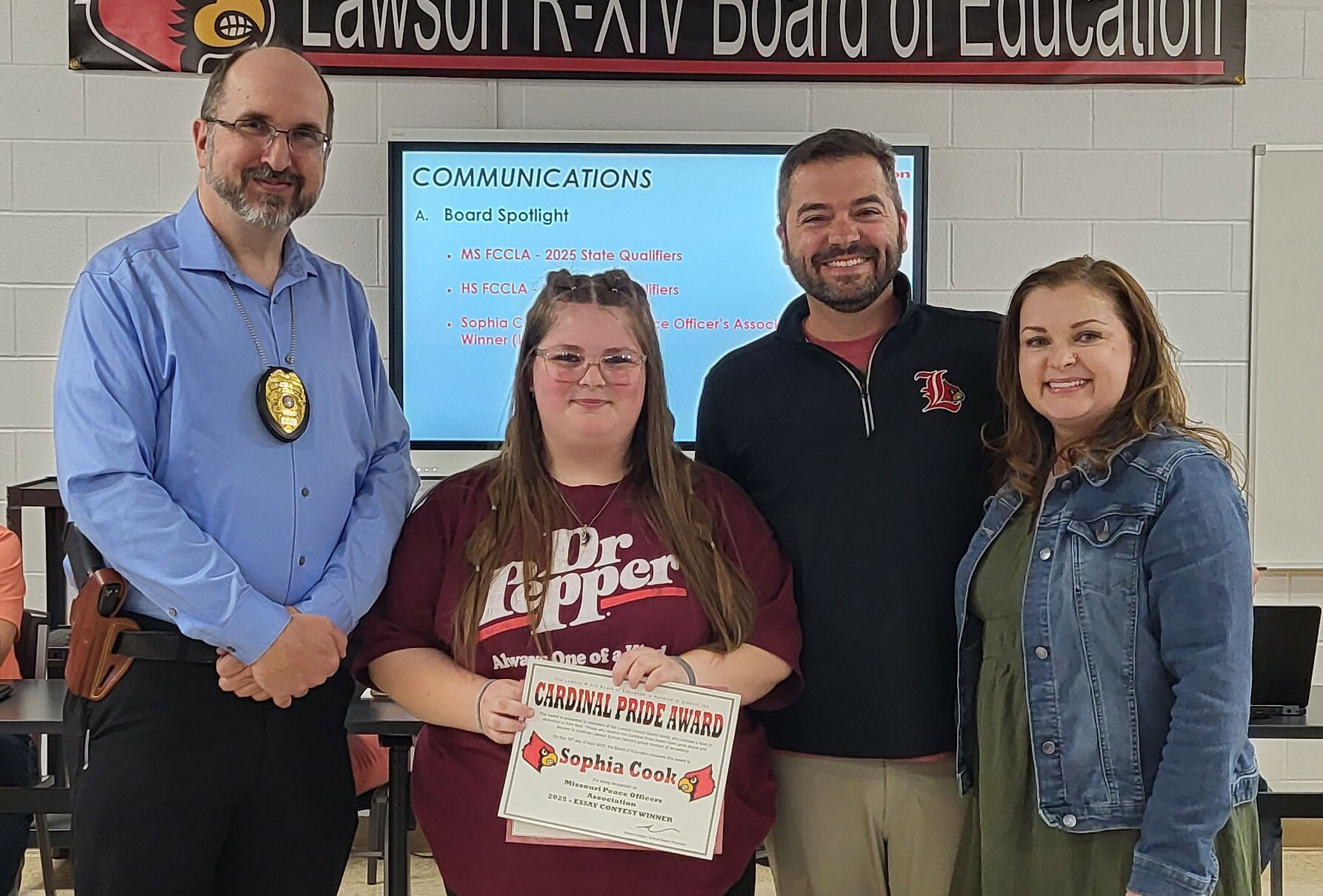 Essay Contest Winner – West Side – 2nd Place – Sophia Cook Lawson Middle School Pictured L to R: MPOA member Chief Bruce Summa (Lawson PD), Sophia, Rob Kellam (School Board President), and Melissa Jones (Sophia’s teacher)